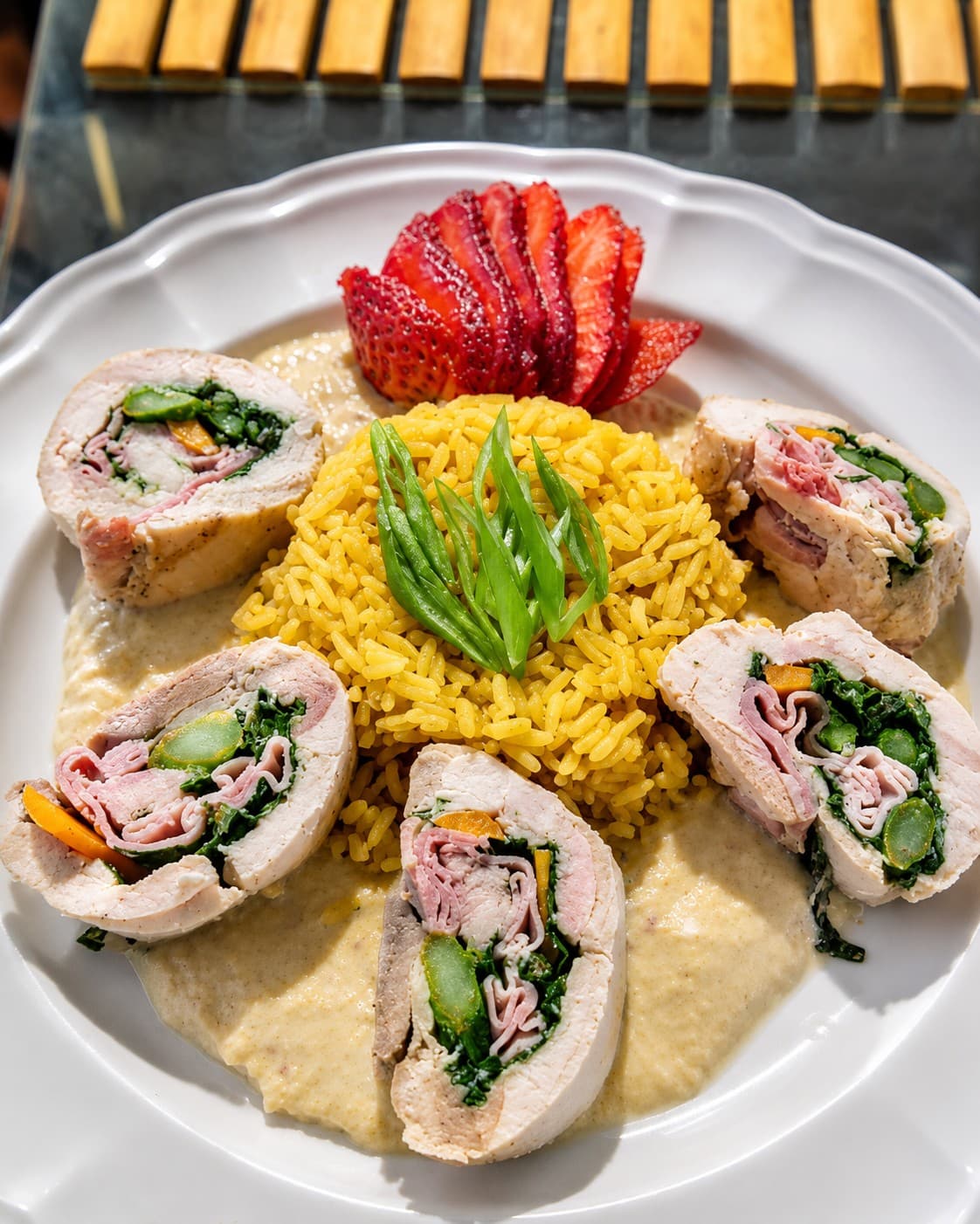 Chicken roulade with yellow rice prepared by Maria Mosquera.