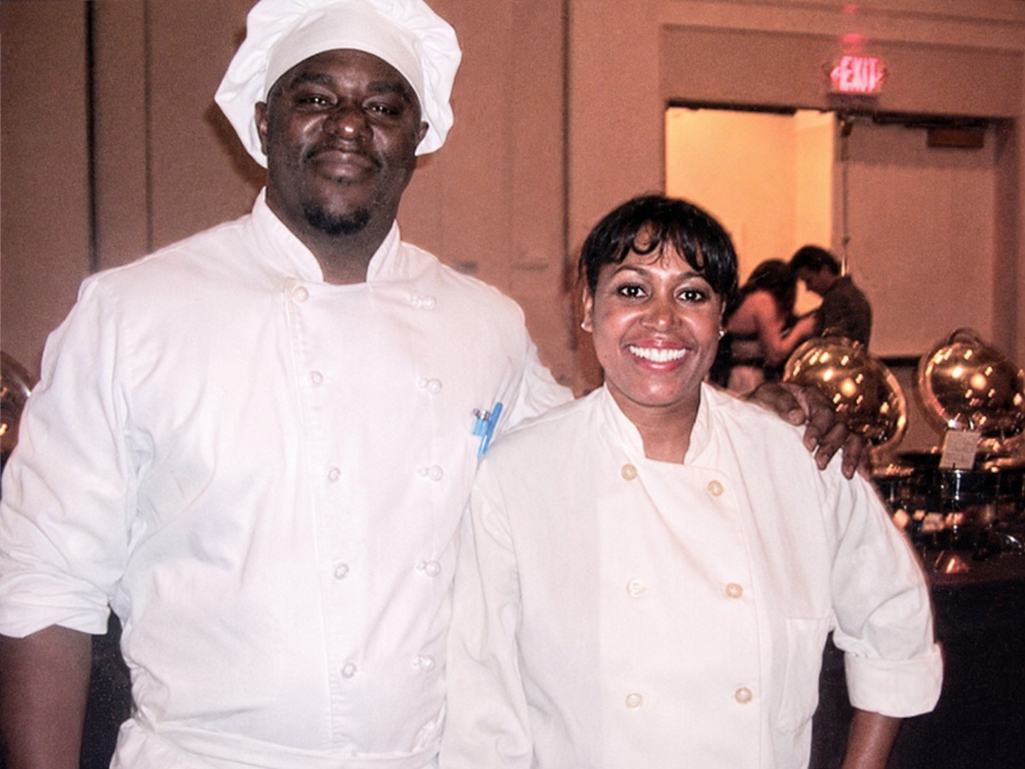 Maria Mosquera in professional chef attire at a banquet event.